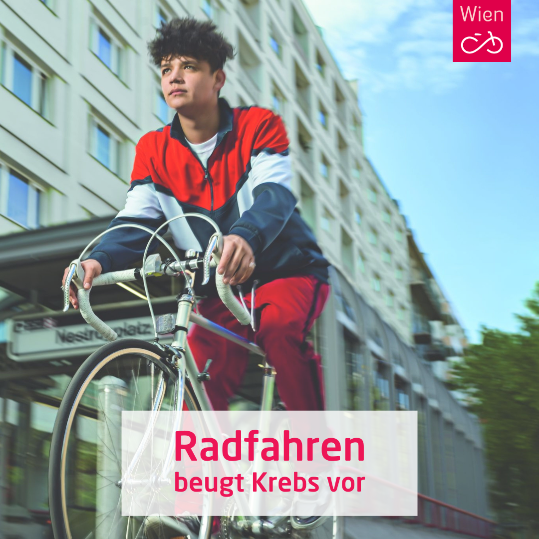 Radfahrer auf der Praterstraße, darüber der Text "Radfahren beugt Krebs vor"